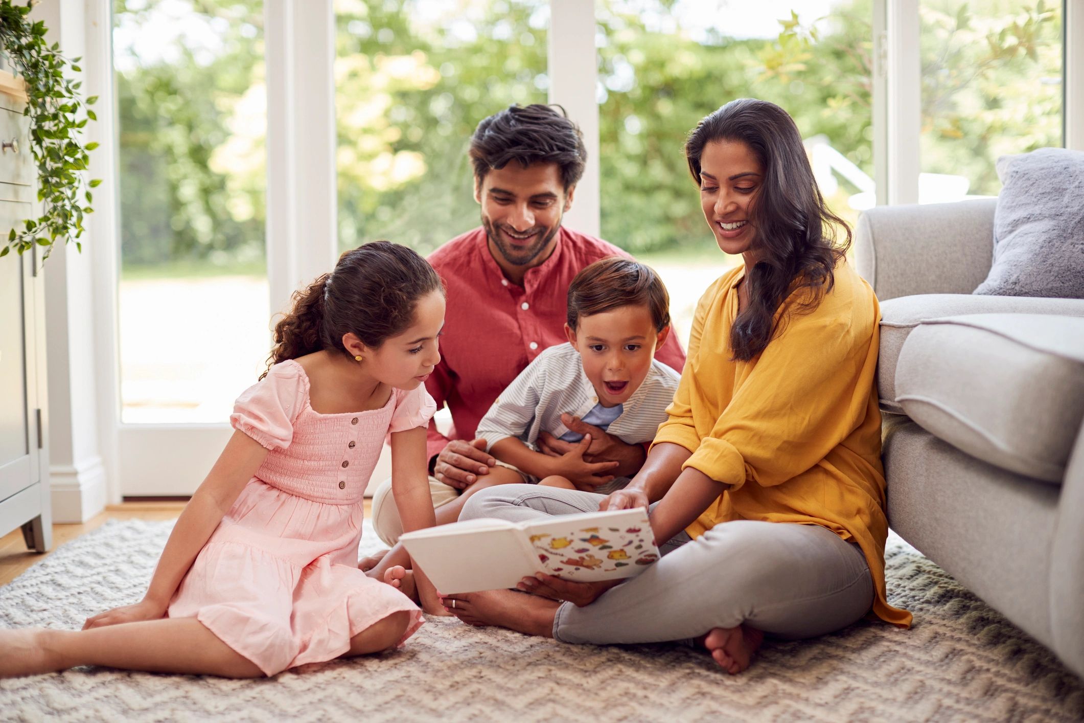 happy Black family reading children's books together